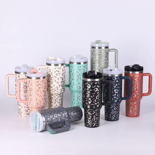 Colorful leopard print travel mugs on white background.