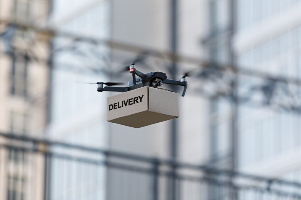 drone-with-cardboard-parcel-and-remote-control