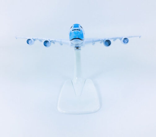 Blue and white airplane model on stand.