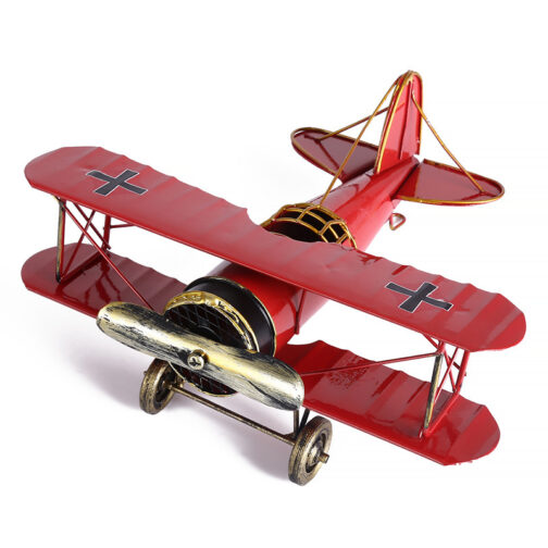 Red vintage biplane toy model, side view
