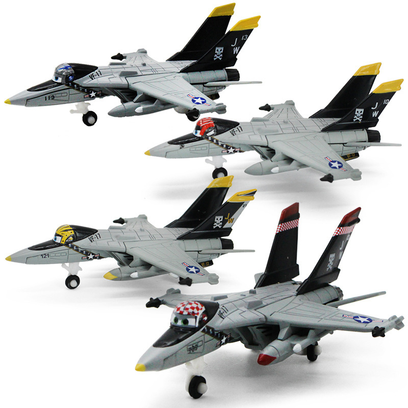 Four toy fighter jets in formation.