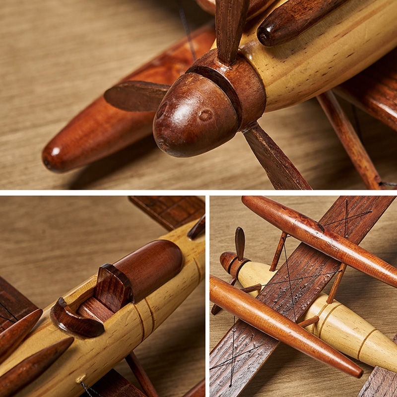 Detailed views of a wooden model airplane.