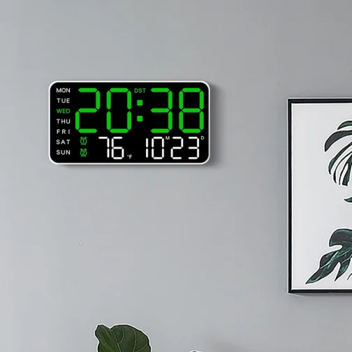 Digital wall clock displaying time and temperature.