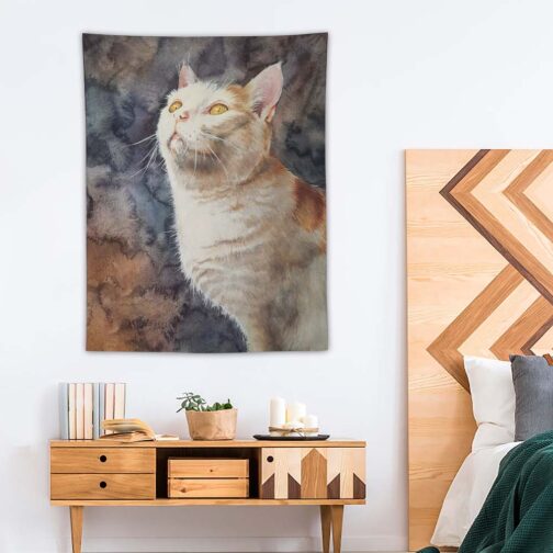 Cat tapestry hanging above modern wooden cabinet.
