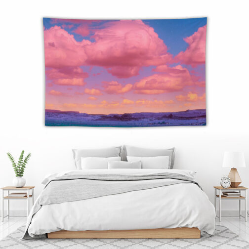 Bedroom with colorful pink cloud tapestry.