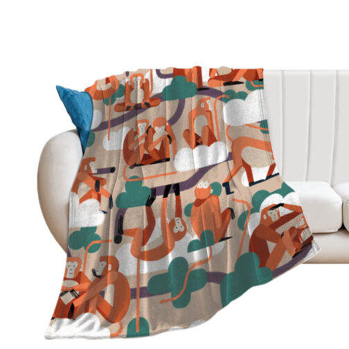 Couch with colorful monkey print blanket