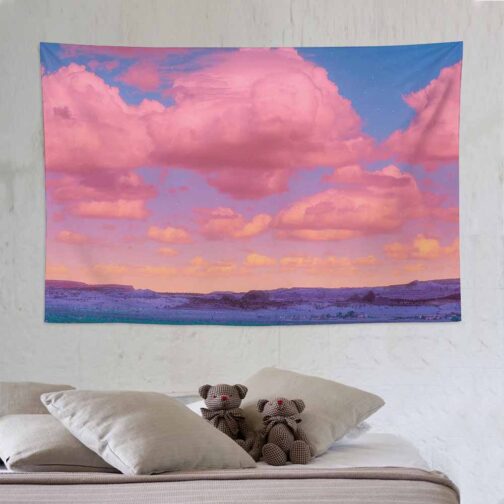 Room with wall tapestry and teddy bears on bed.