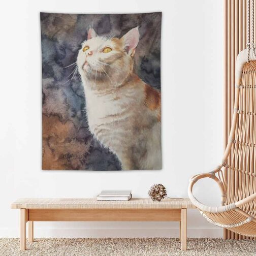 Cat tapestry decor on wall beside wicker chair