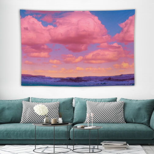 Room with teal sofa and sunset tapestry.